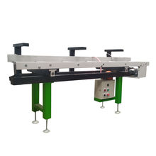 Powered infeed table system with pneumatic fence